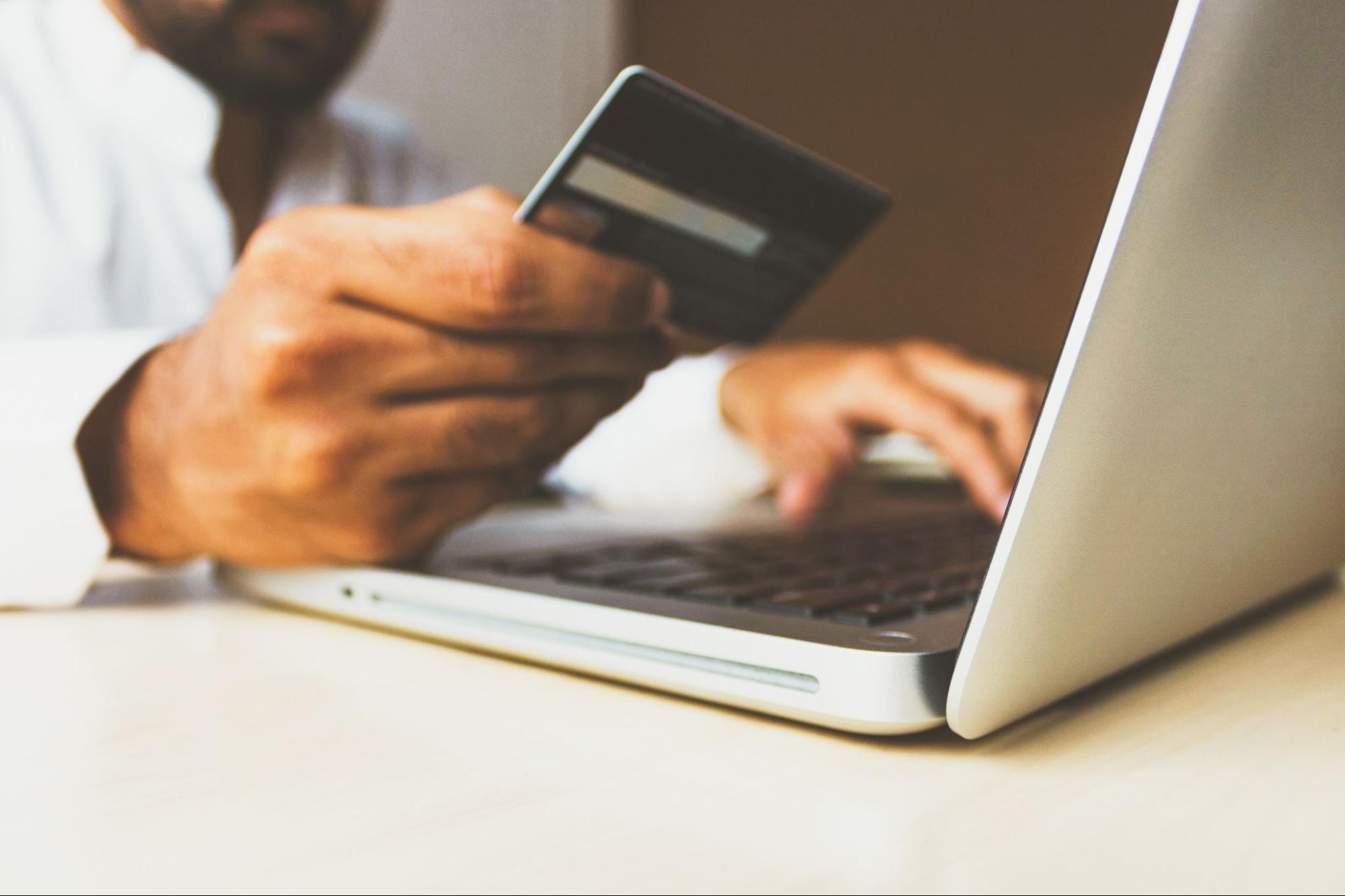 man-paying-with-credit-card-online